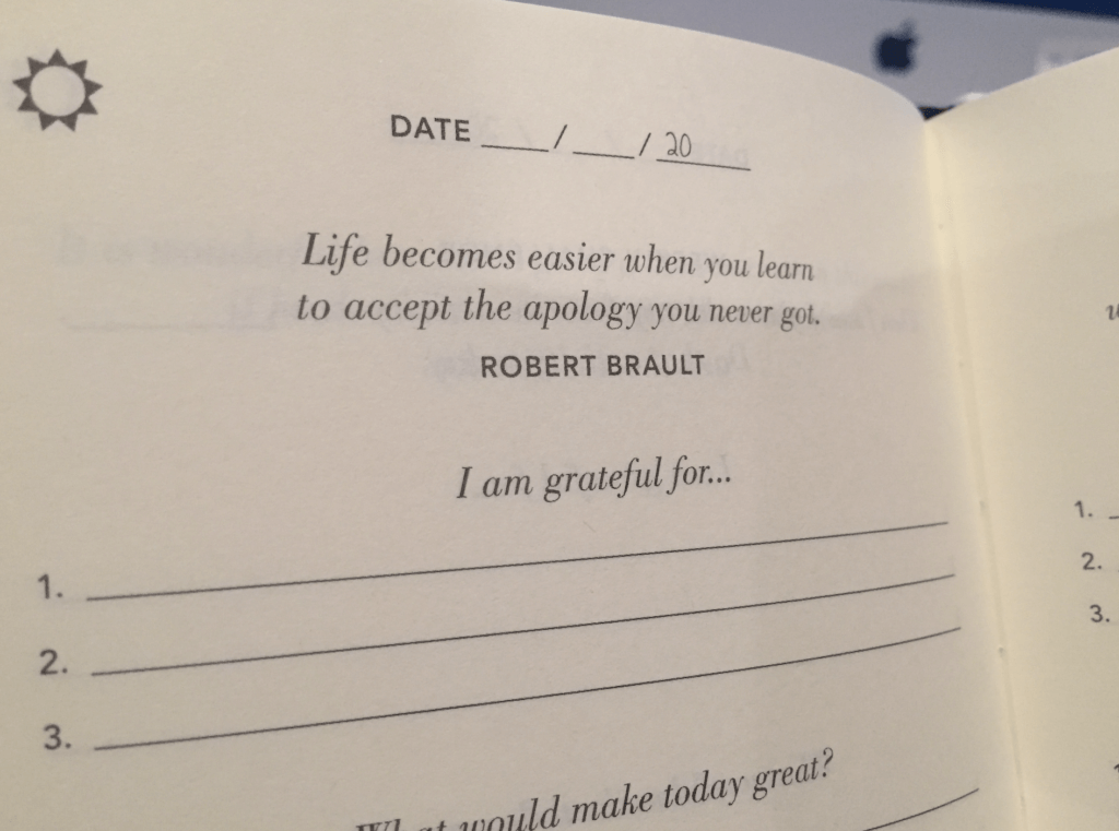 Image of the journal with a fill-in-the-date section. Quote at the top: "Life becomes easier when you learn to accept the apology you never got. — Robert Brault"

Then it reads, "I am grateful for..." with space to fill in three things.