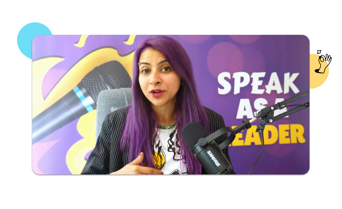Nausheen I. Chen seated in front of a mic with "Speak as a Leader" written on the wall in the background.